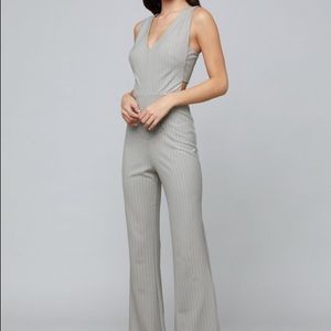 Bebe Gray Mitered pinstripe V-neck jumpsuit.